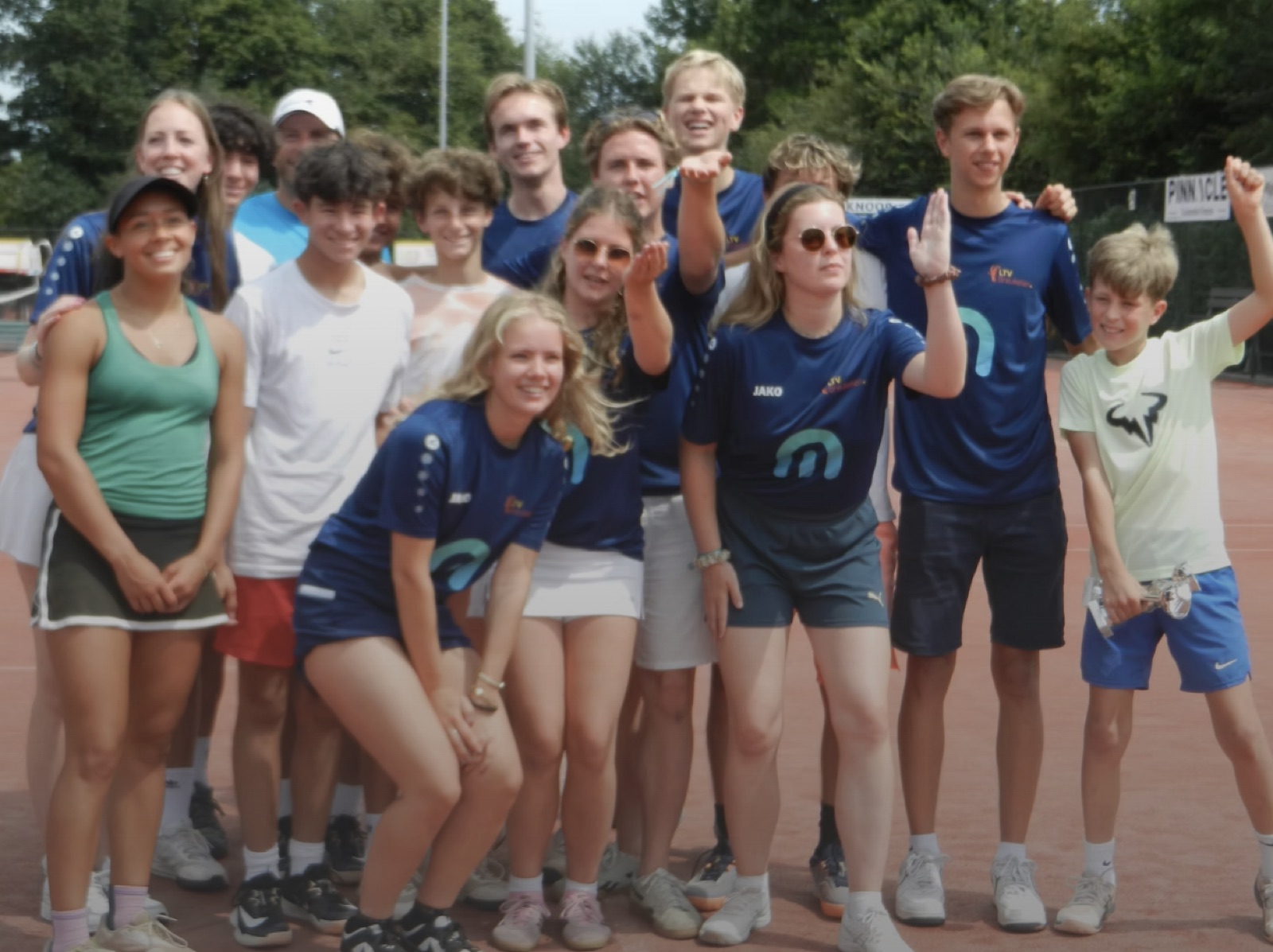 A Tennis: Europe team celebrating together at a tournament