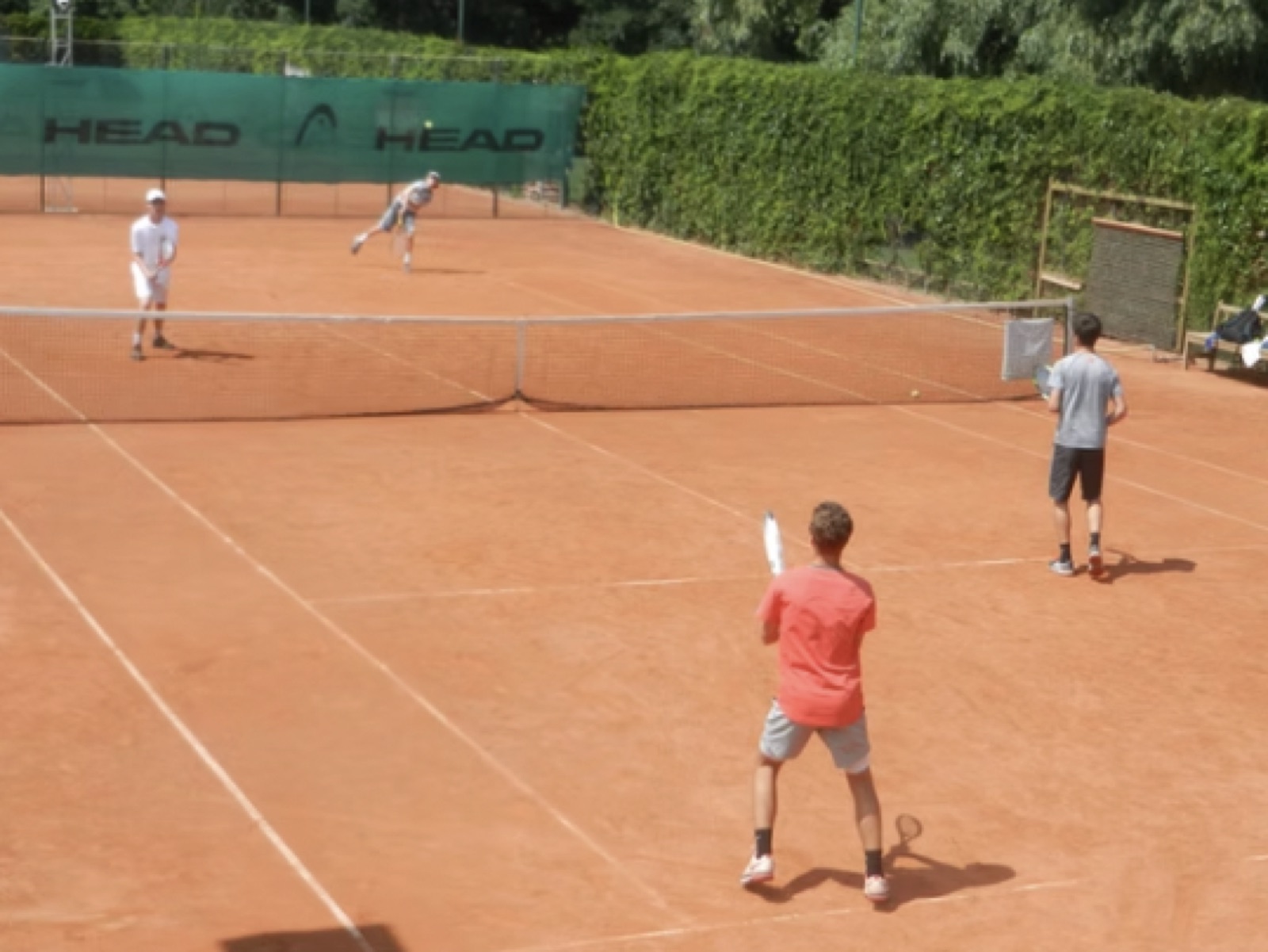 Match play on a red clay court