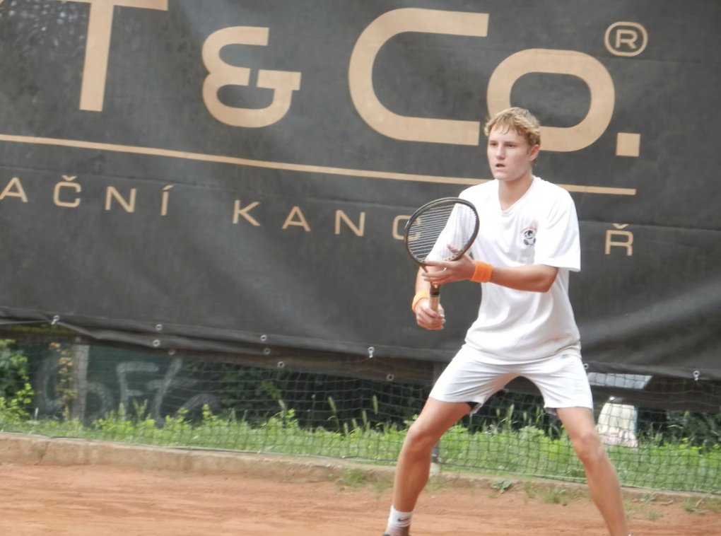 A player hitting a forehand on red clay