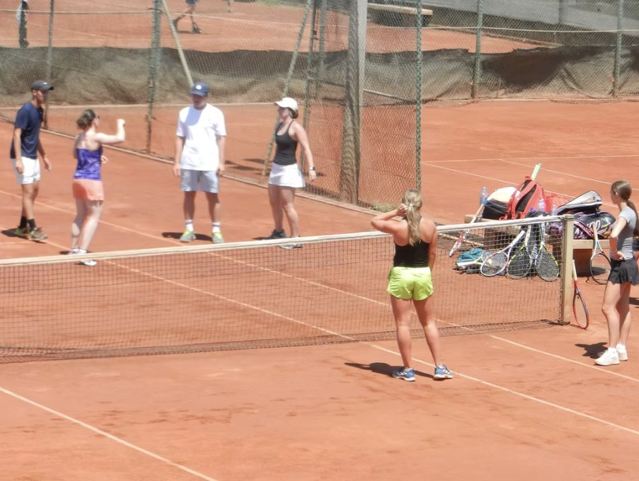 Group practice on the clay courts